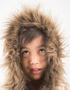 Little boy wearing fur coat protect from cold snow over head Royalty Free Stock Photo