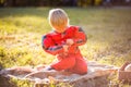 Little boy wearing Halloween suits sitting on grass Royalty Free Stock Photo