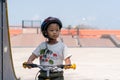 Little boy wearing helmets ridding bike