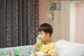 Little boy wearing oxygen mask in hospital ward Royalty Free Stock Photo