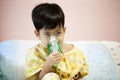 Little boy wearing oxygen mask in hospital ward Royalty Free Stock Photo