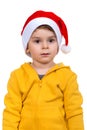 Little boy wearing on red Santa helper hat. Isolated over white background. Royalty Free Stock Photo