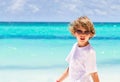 Little boy wearing sunglasses on tropical beach Royalty Free Stock Photo