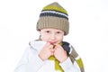 Little boy wearing winter outfit isolated on white