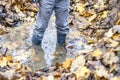 Little boy with wellys in the puddle