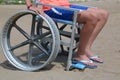 Little boy on the wheelchair on the beach