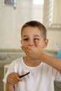 Little boy in white t-shirt brushing his teeth.Milk teeth are replaced by molars Royalty Free Stock Photo