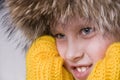 Little boy winter portrait in the fur-cap Royalty Free Stock Photo