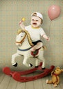 Little boy on wooden horse
