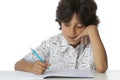 Little boy is writing in his exercise book Royalty Free Stock Photo