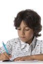 Little boy is writing in his exercise book Royalty Free Stock Photo