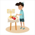 Little boy in yarmulke eat apple with honey, Jewish children dipping apple slices into honey on Rosh HaShanah. Happy Royalty Free Stock Photo