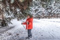 Little boy 3-5 years old, happy standing on a skis. In a warm hat and jacket. The first steps in the winter forest. A