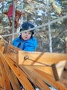 Little boy mountaineering in winter