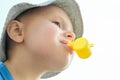 Little boy with a yellow whistle in his mouth Royalty Free Stock Photo