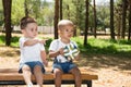 Little boys: African American and caucasian with soccer ball in park on nature at summer. Royalty Free Stock Photo