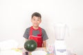 Little boys blend water melon juice by using blender