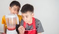 Little boys blend water melone juice by using blender home