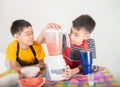 Little boys blend water melone juice by using blender home Royalty Free Stock Photo