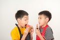 Little boys eat watermelon white
