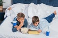 little boys eating popcorn and drinking soda while resting Royalty Free Stock Photo