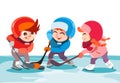 Little boys and girl playing hockey on ice rink in park. Royalty Free Stock Photo