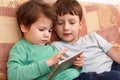 Little boys playing on tablet