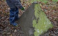 Little boys playing on throwing walls with mud cement plaster. they borrowed tools from dad. spatulas smear mud like tile adhesive