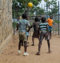 Little boys playing with the wheels on the street in Africa Royalty Free Stock Photo