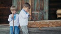 Little boys playing on woodwind wooden flutes - ukrainian sopilka. Duet folk music concept. Musical instrument. Kids in