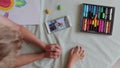 Little boys sitting at table and drawing with colored pencils online