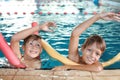 Little boys with swimming noodles Royalty Free Stock Photo