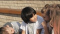 Little boys talking to the girls.