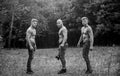 Little break. bodybuilders in jeans. Three sexy guys. brutal guys pose with naked torso. handsome guys with sexy body