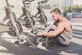 Handsome young man lace shoes at gym after training Royalty Free Stock Photo