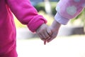 Little brother holding his oldest sister hands , Asian two person background