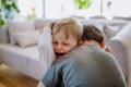 Little brother hugging his crying sister, consoling her. Royalty Free Stock Photo