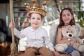 A little brother and sister enjoy posing for a photo while playing at home together. Family, leisure, together Royalty Free Stock Photo