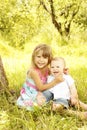 Little brother and sister playing on the nature Royalty Free Stock Photo