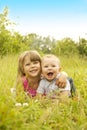 Little brother and sister playing on the nature Royalty Free Stock Photo