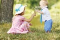 Little brother and sister playing on the nature Royalty Free Stock Photo