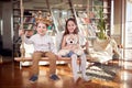 A little brother and sister playing and posing for a photo at home together. Family, leisure, together Royalty Free Stock Photo