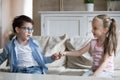 Little brother and sister reconcile after fight joining pinkies Royalty Free Stock Photo