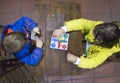 Little brothers playing Parchis over wooden vintage table Royalty Free Stock Photo