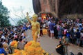 Little buddha statue in crowd of people Royalty Free Stock Photo