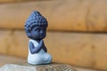 Little Buddha statue image used as amulets of Buddhism religion. Meditation concept with empty space for text Royalty Free Stock Photo