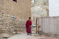 Little Buddhist monk lama in traditional robe at Tibetan Hemis monastery in Leh, Ladakh, Jammu and Kashmir Royalty Free Stock Photo