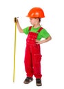 Little builder in helmet with ruler tape Royalty Free Stock Photo