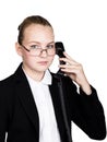 Little business woman talking on a phone, screaming into the phone. Studio portrait of child girl in business style Royalty Free Stock Photo