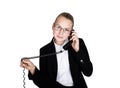 Little business woman talking on a phone, screaming into the phone. Studio portrait of child girl in business style Royalty Free Stock Photo